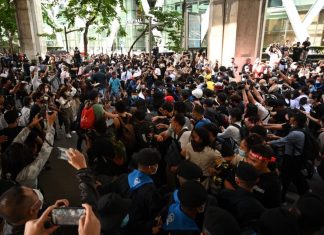 Pro-democracy demonstrators regroup in major business district of Bangkok following police dispersal this morning