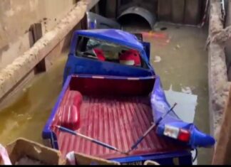 Out of control pickup truck narrowly misses row of food vendors, crashes into construction pit in Chonburi, vendors say religious amulets saved them