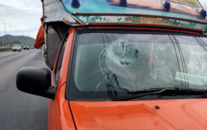 Driver uninjured after a piece of flying tire hits his windshield causing serious damage while driving in Sri Racha
