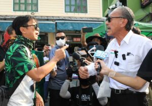 Thai Anti-Cannabis Whistleblower Faces off with Cannabis Seller on Khao San Road