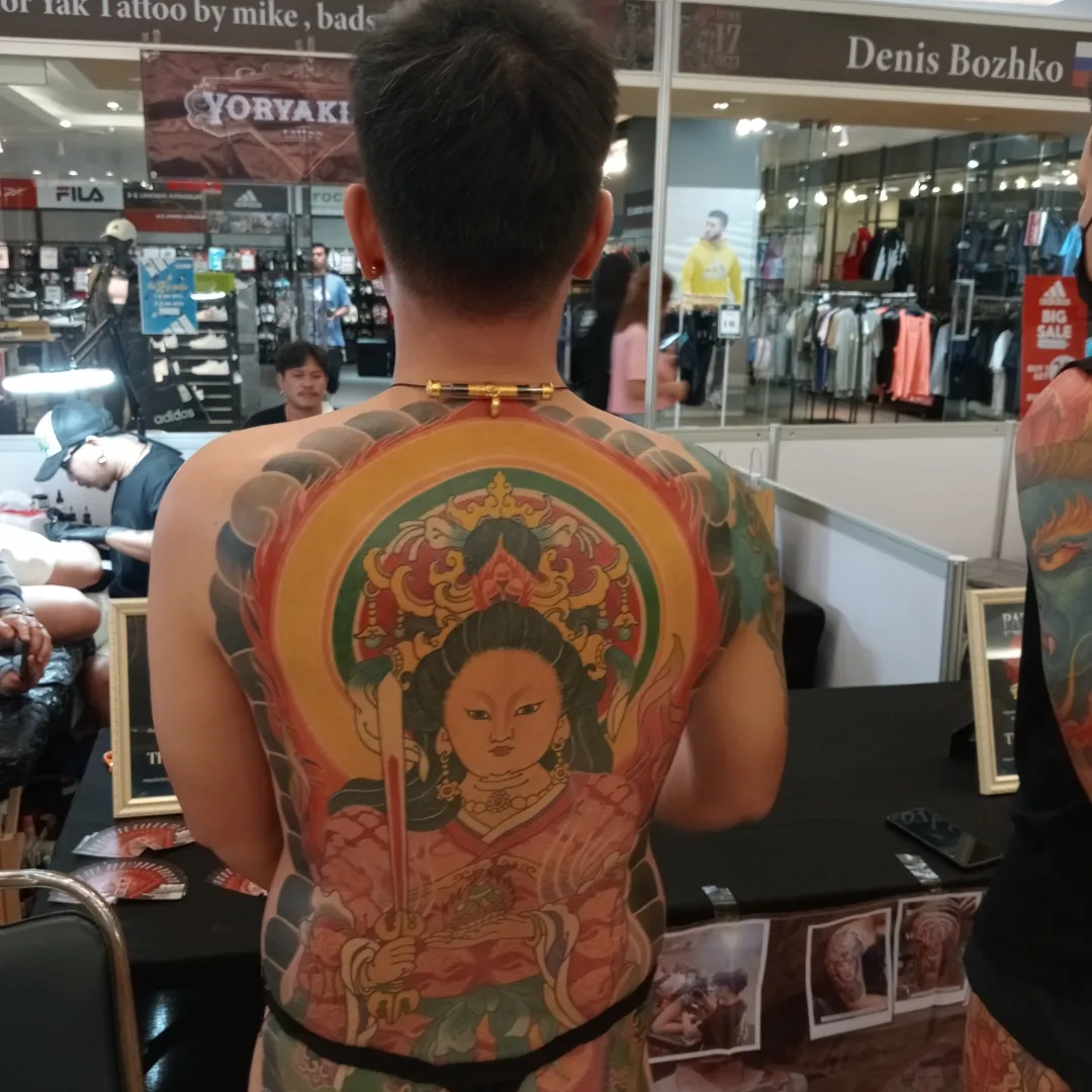 Big buddha and buddhist symbolism tattoo on whole back | Buddhist tattoo,  Back tattoos for guys, Spiritual tattoos