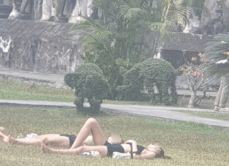 Foreign Tourists Sunbathing on Chiang Mai Temple Premises Spark Outrage Among Local Residents