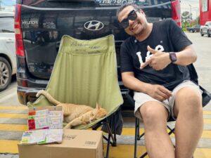 Ginger Cat at Pattaya Gas Station Becomes Local Star with Lottery Display