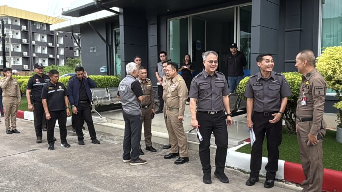Pattaya news press photograph of Thai officials during the Department of Special Investigation search of premises linked to suspected nominee shareholding networks in Pattaya Thailand