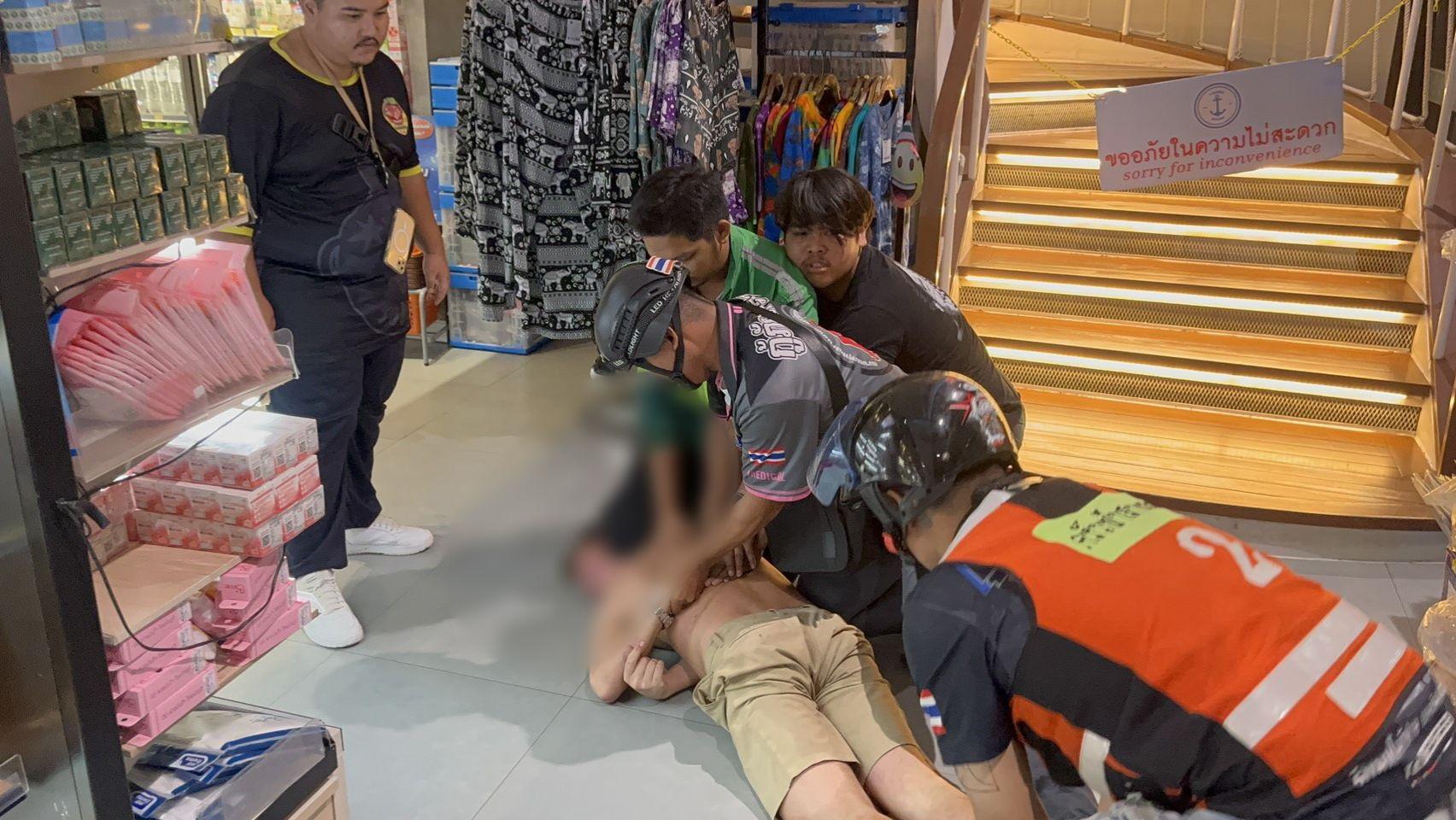 Pattaya news press photograph of Thai police and rescue workers at the scene of a dawn assault on South Pattaya Road in Pattaya Thailand