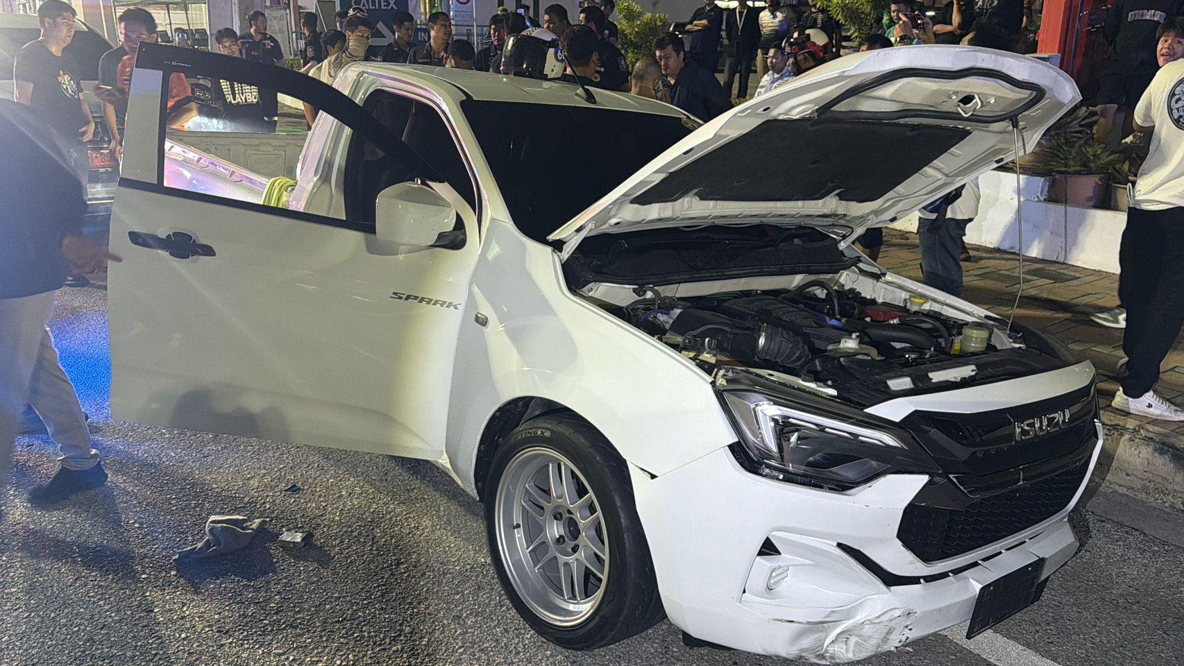 Pattaya news photo: scene after the drug suspect's pickup crashed through a Pattaya Thailand gas station office during a police operation