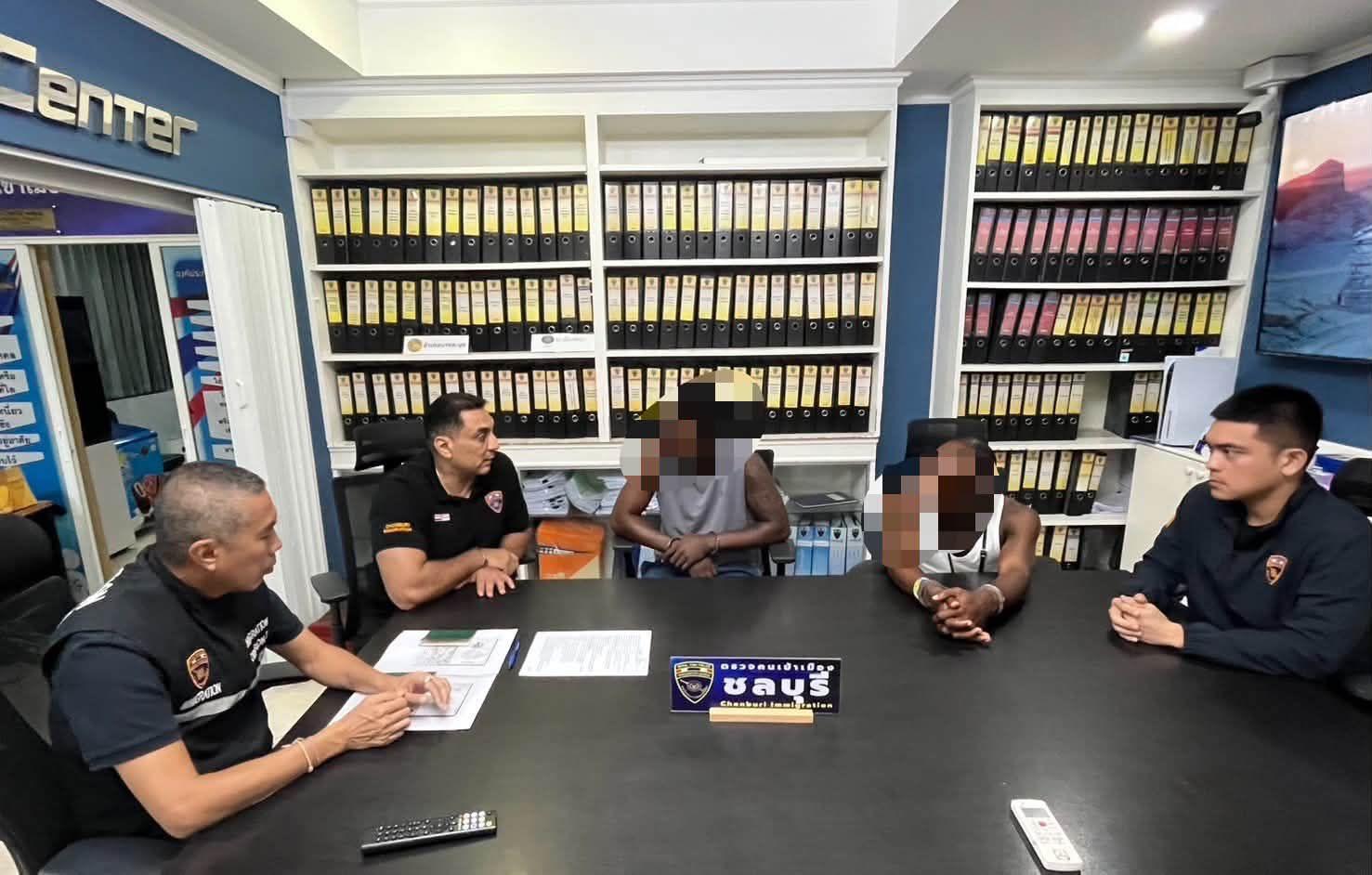 Pattaya news photo: Chonburi Immigration officers display cocaine seized from a Pattaya Thailand condo kitchen extractor hood
